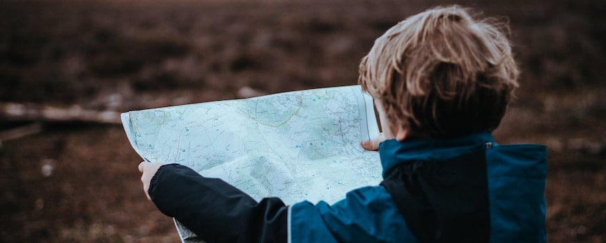 Young boy looking at map Young boy looking at map